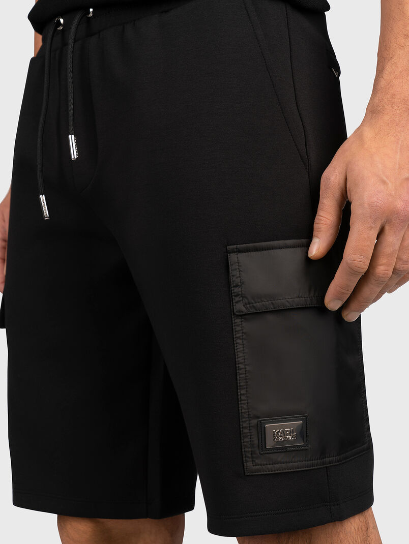 Short black pants with accent pocket - 3