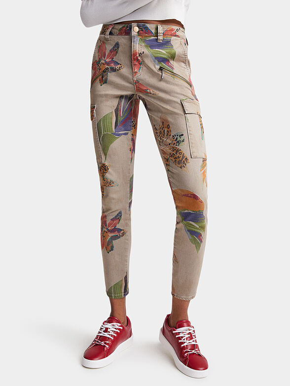 Trousers in beige color with floral motifs - 1