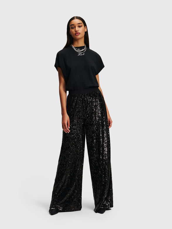 Pants with appliquéd sequins - 1