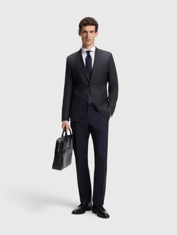 A suit made of a wool and silk blend - 1