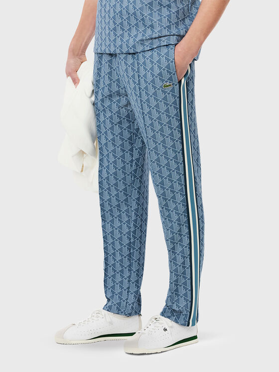 Sports trousers with monogram print - 1