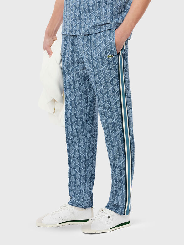 Sports trousers with monogram print - 1