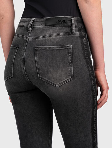 Skinny jeans with branded straps - 4