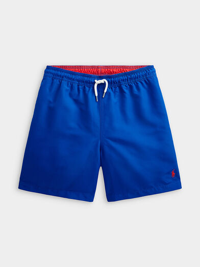 Blue swim trunks with logo accent - 1