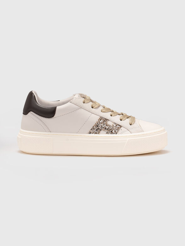 Sneakers with a logo featuring shiny elements - 1