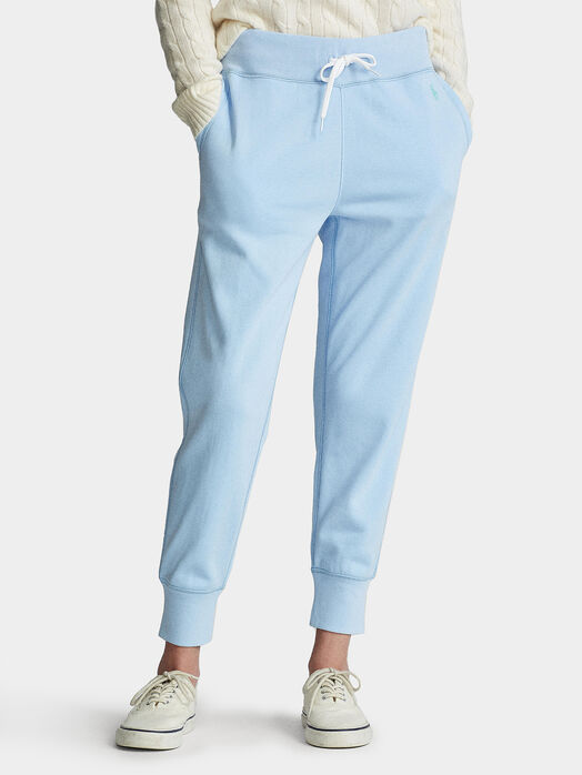 Light blue sports trousers with logo embroidery