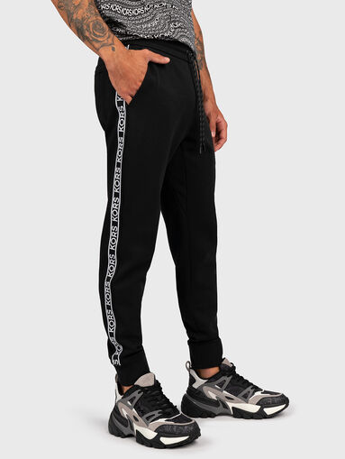 Sports trousers with logo stripe - 3