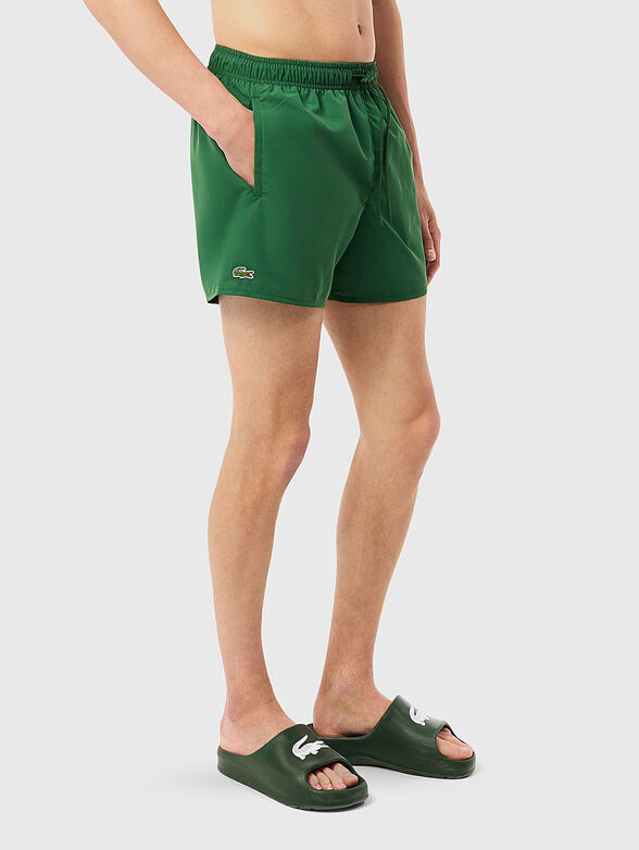 Yellow shorts with logo detail - 1