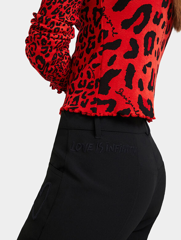 Trousers with embroidered details - 6