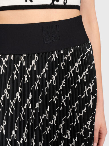 Skirt with soleil and logo motifs - 4