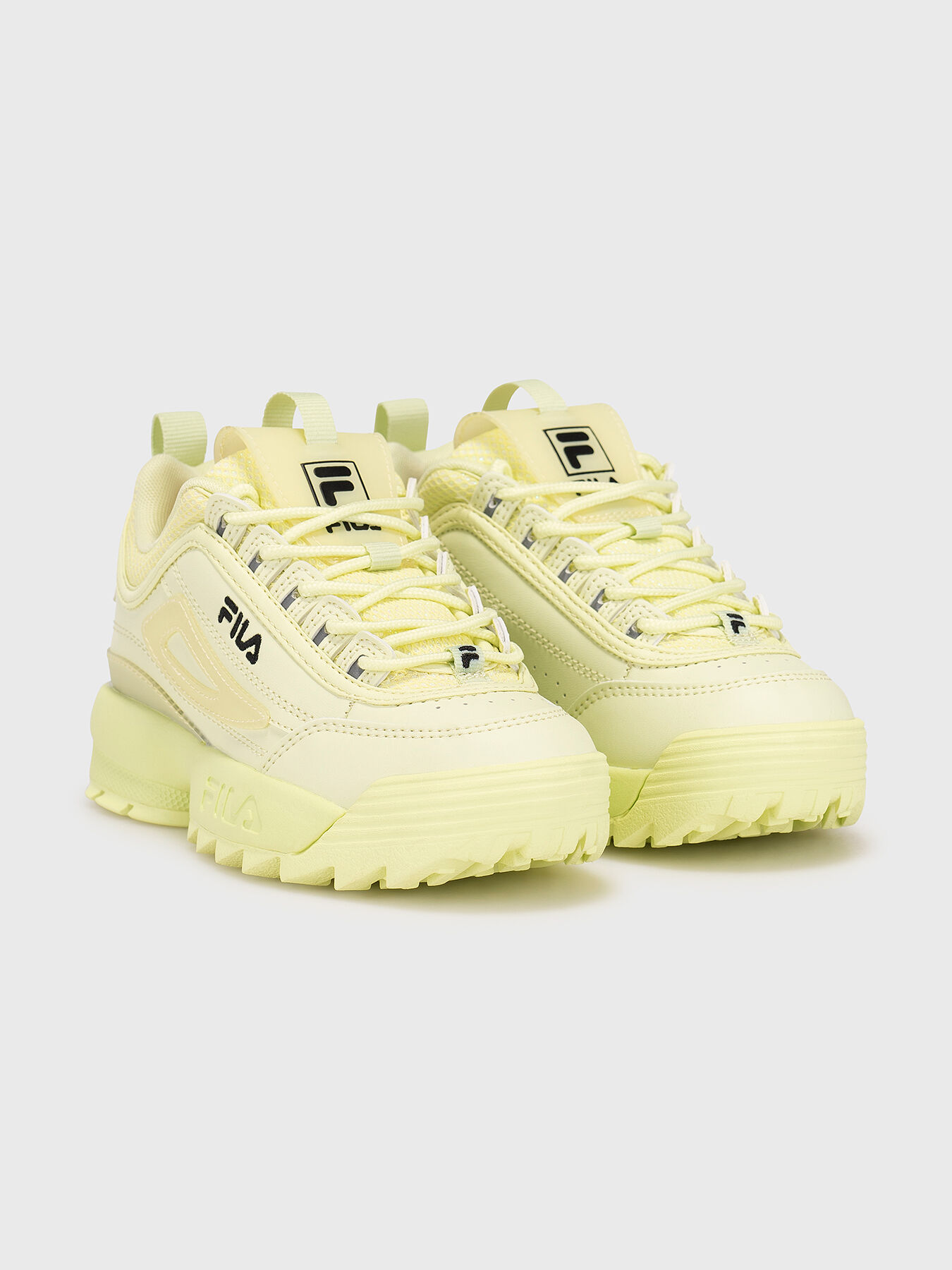 Yellow and white fila shoes outlet
