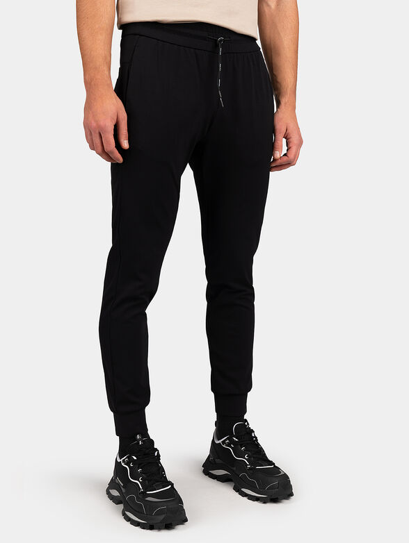 Sports pants with logo patch - 1