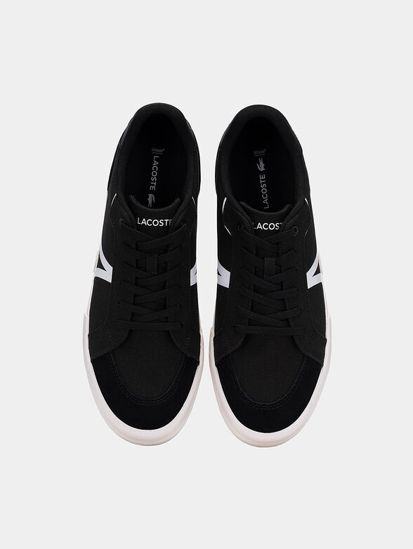 Black sneakers with laces and white accents - 6
