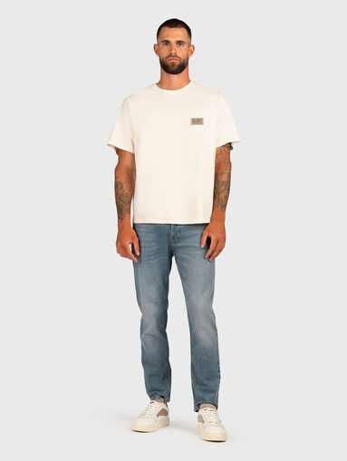 Jeans with washed effect and logo - 5