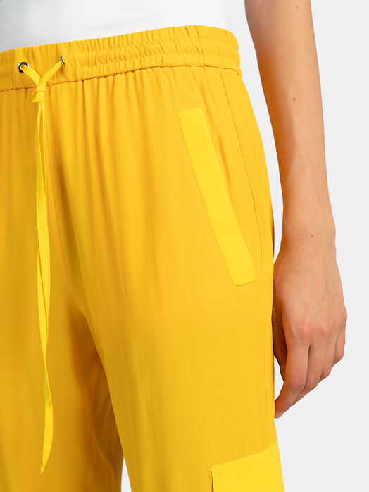 Yellow cargo trousers