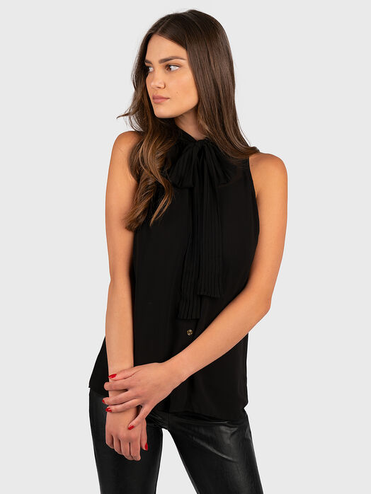 Black sleeveless top with bow