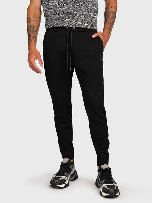 Sports trousers with logo stripe