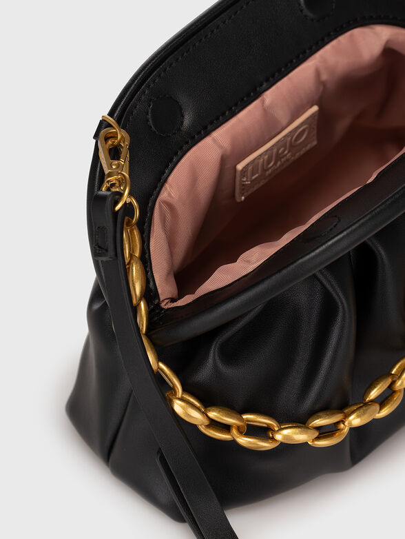 Black handbag with golden details - 6