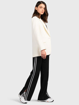 Trousers with flared legs with slits - 5