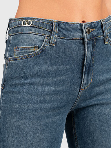 Jeans with logo accents at the waist - 4