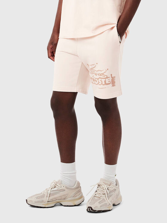 Cotton shorts with logo print in ecru - 1