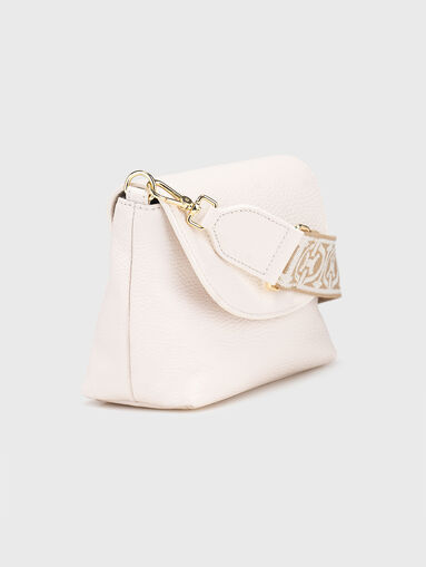 Leather bag with accent strap - 4