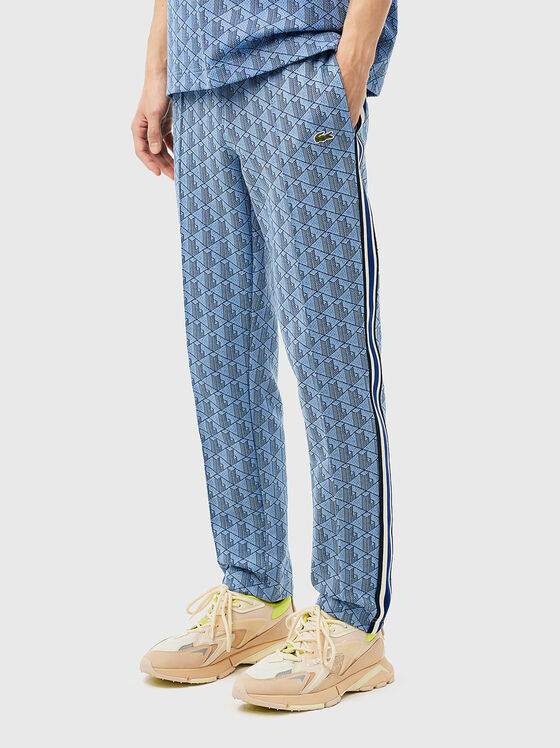 Sports trousers with monogram print - 1