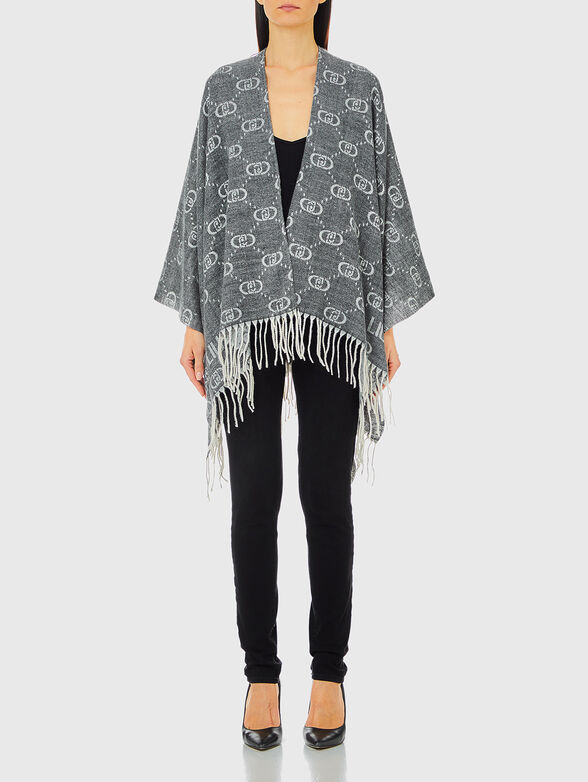 Poncho with monogram print in beige - 1