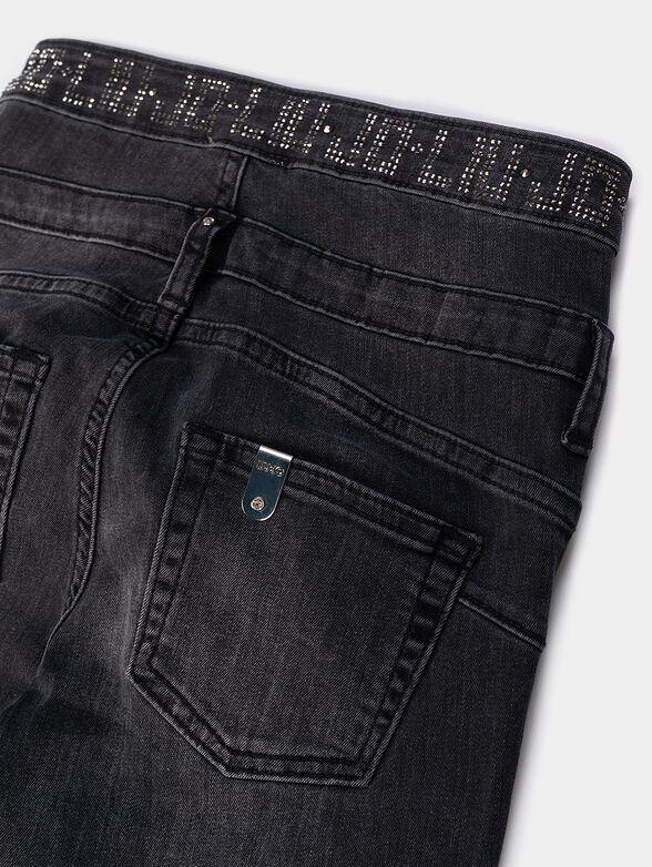 Black jeans with washed effect and shiny accents - 4