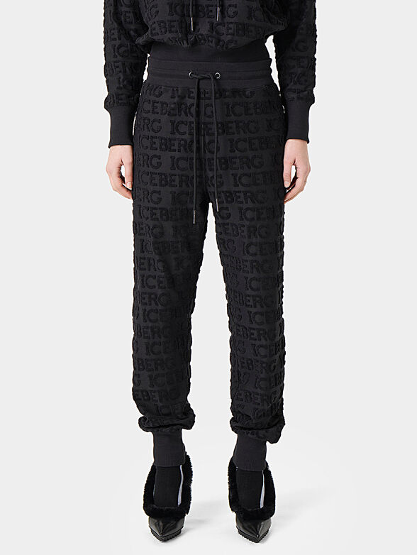 Pants with embossed logo texture - 1
