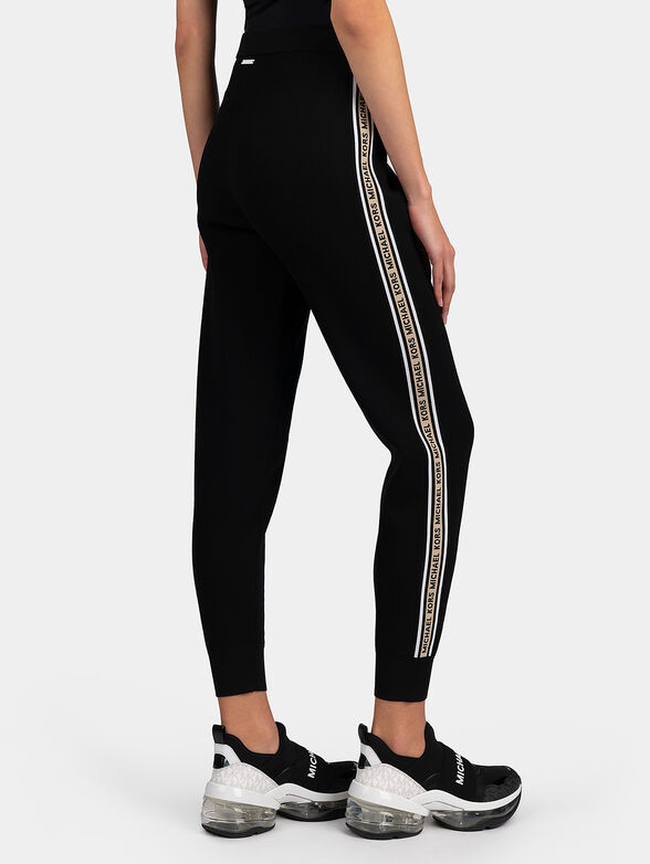 Track pants with branded stripes - 2