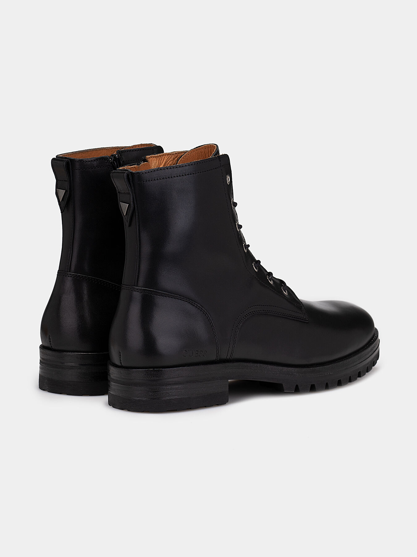 Black leather boots brand GUESS — Globalbrandsstore.com/en