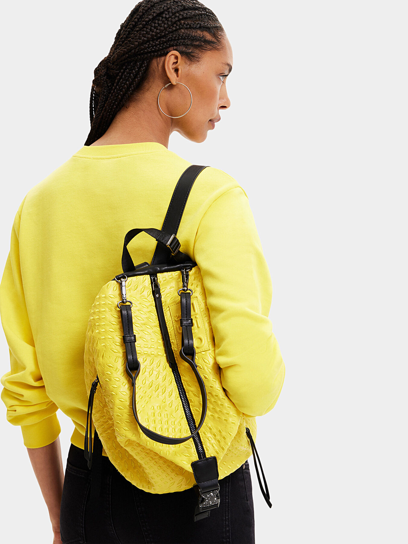 Backpack in bright yellow color with logo patch brand DESIGUAL Globalbrandsstore en