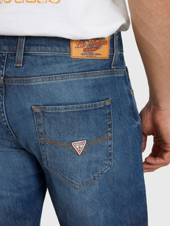 RODEO jeans with washed effect brand GUESS — Globalbrandsstore.com/en
