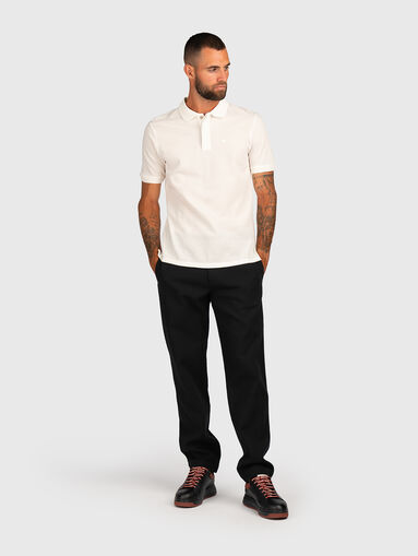 Trousers with pockets and logo detail - 5