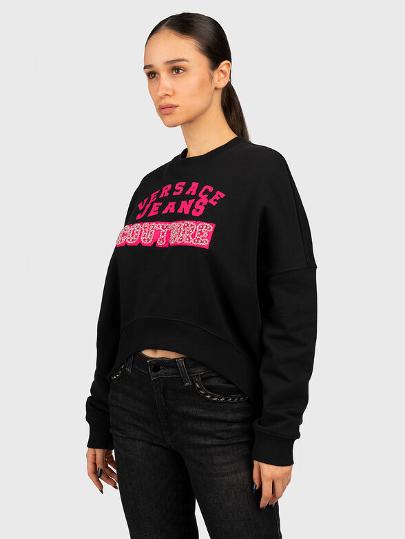 Logo-print sweatshirt in black - 1