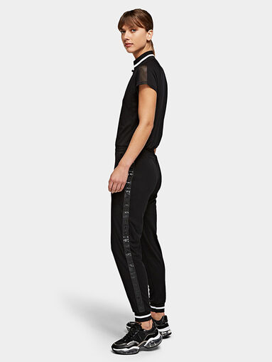Black jumpsuit with branded tapes - 3