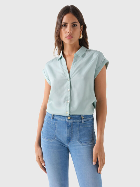Sleeveless shirt in pale green colour - 1