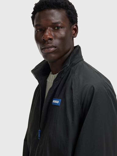 Hooded jacket with logo patch - 5