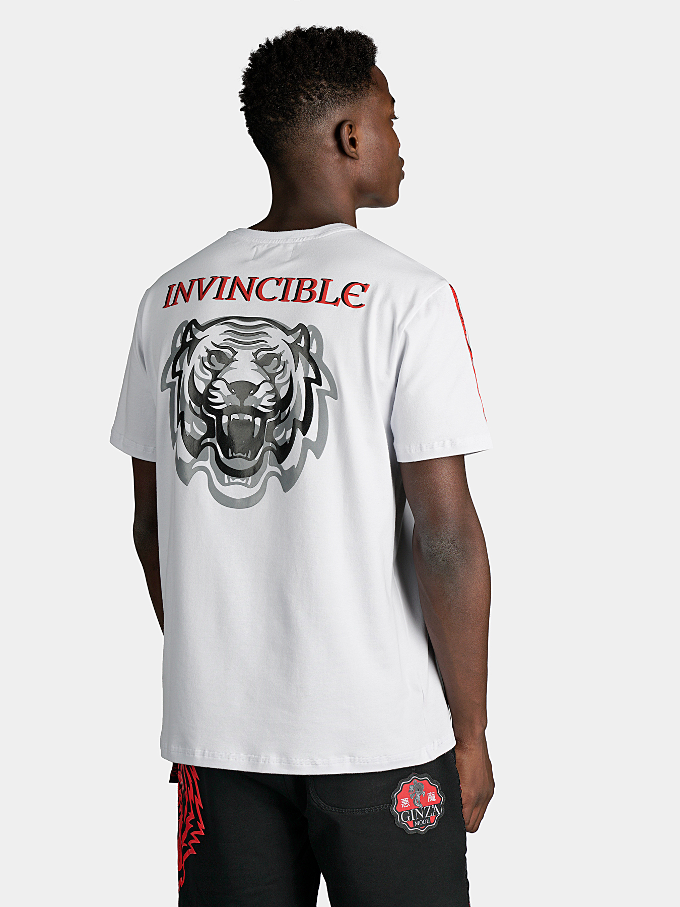 White T-shirt with contrasting prints and logo accents brand