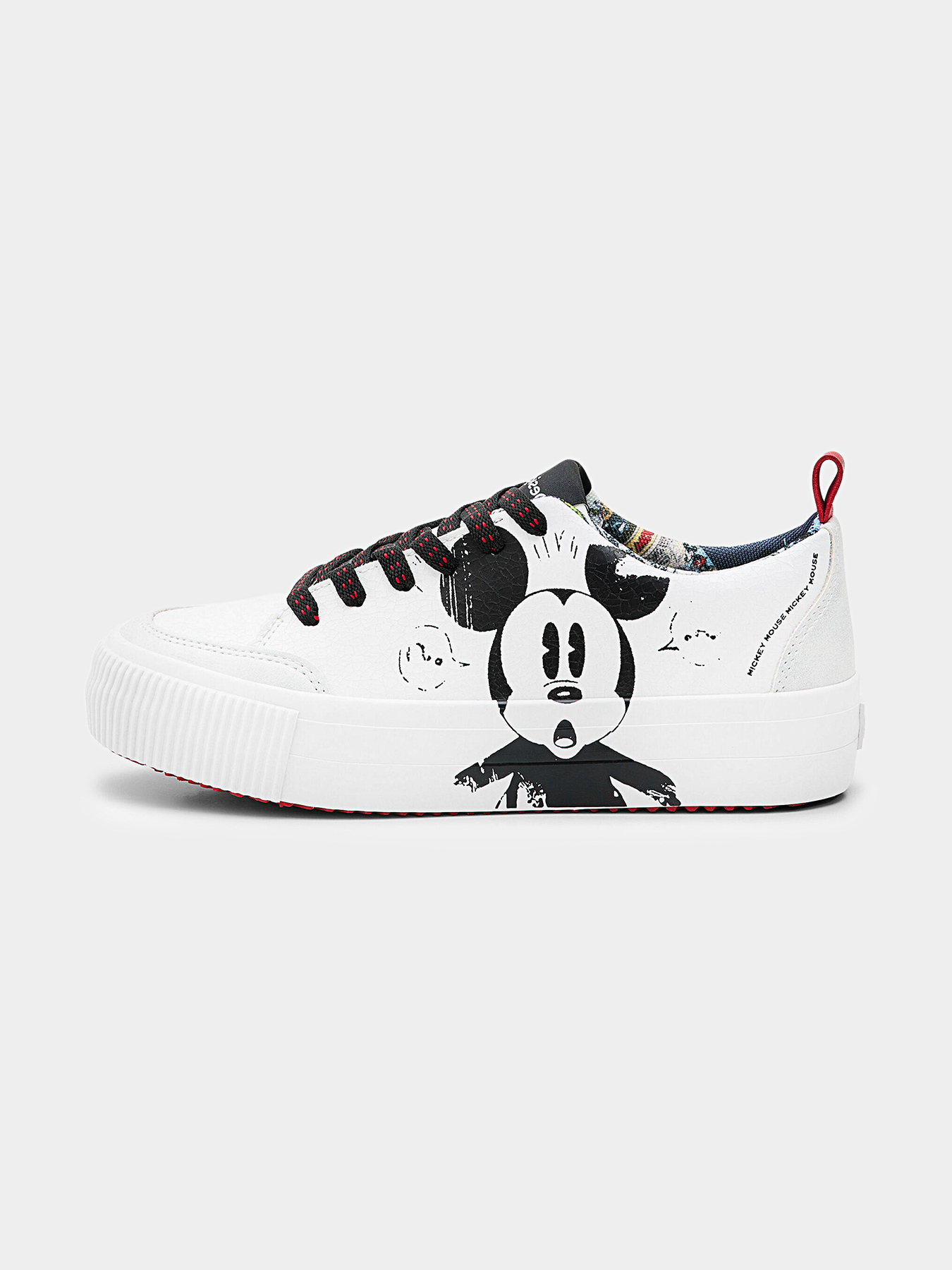 White sports shoes with Mickey Mouse accent brand DESIGUAL